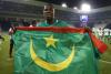 اللاعب آدما با يرفع علم موريتانيا في إحدى المباريات- صفحة اللاعب بفيسبوك
